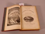 an open book with a picture of a mountain scene on it