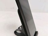 a cell phone that is sitting on a stand