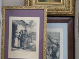 three framed pictures in a box on the wall