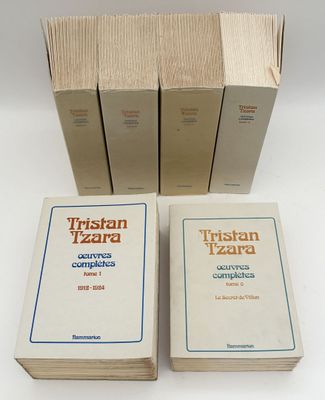 three books are stacked on top of each other on a table