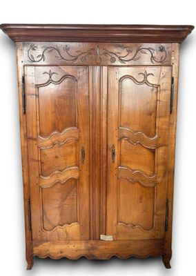 an image of a wooden armoire with two doors on each side