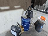a blue barrel sitting next to a blue fire hydrant