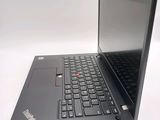 a laptop with a black keyboard on a white surface