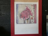 a picture of a painting of a fish in a red frame