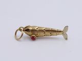 an image of a gold fish charm on a white background