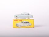 two toy cars sitting on top of a yellow box