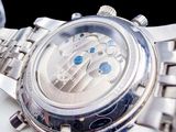 a close up of a watch on a white plate