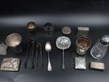 a lot of silver objects on a black surface