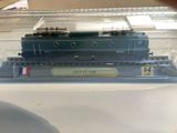 a model train in a clear box on a table