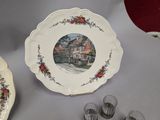 a plate with a picture of a house on it