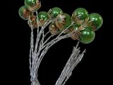a bunch of green and gold flowers on a silver wire