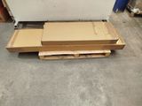 a box on a pallet in the middle of the floor