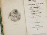 an open book with a drawing of a woman in a hat