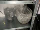 a shelf that has some cups and bowls on it