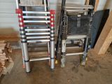 two ladders sitting next to each other in a room