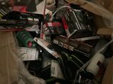 a cardboard box full of wine bottles and other items