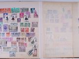 an open book with a lot of stamps on it