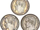 three british silver sovereigns, one of which has a head of a woman and one of which is a