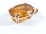 an image of a yellow gold ring with a large citrine stone