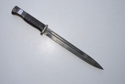 a picture of a knife on a white surface