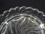 a clear glass bowl with a spiral design on it