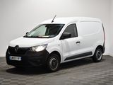 la camionnette blanche est garée dans une pièce au sol en damier