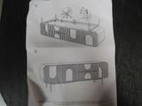 two drawings of a table with a clock on it