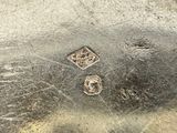 a close up of a metal object with holes in it