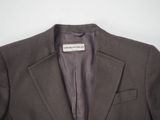 a close up of a suit jacket with a label on it