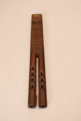two wooden pegs sitting on a white surface