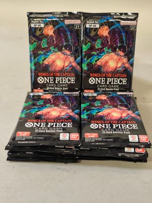 a stack of one piece trading cards sitting on top of each other