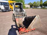 a bulldozer that is sitting in the dirt