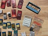 many different types of sewing needles on the table