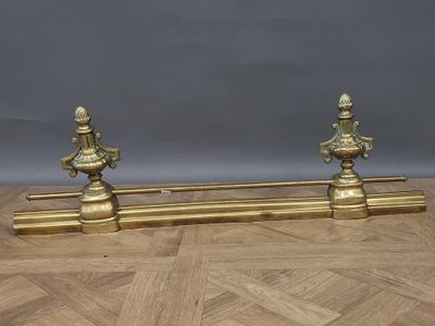 pair of antique brass candlesticks on a wooden table