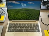 a laptop that is sitting on a desk with other electronics