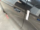 a picture of a car door with a sticker on it