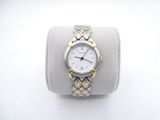 wrist watch with two tone gold accents on a white display case