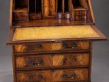 an antique writing desk with drawers and drawers on top