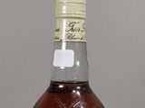 a bottle of whiskey that is sitting on a table