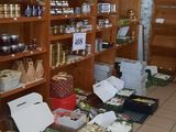 many shelves of food in a store with food on the floor