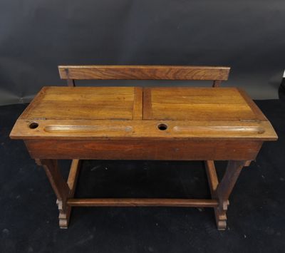 an old wooden desk with two drawers and a drawer underneath it