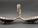 pair of silver plated bowls with handles and feet