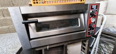 an image of a commercial oven with a basket on top of it