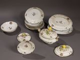 a lot of plates and bowls that are sitting on a table