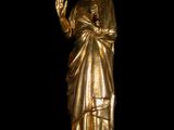 gold statue of a woman holding a baby in her arms