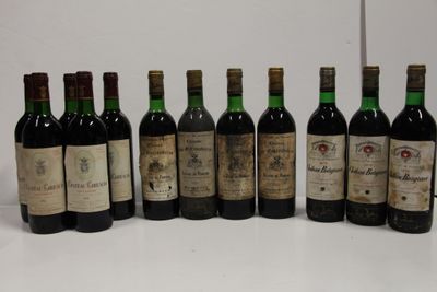 several bottles of wine are lined up on a white surface