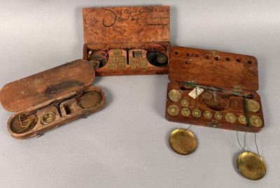 a small wooden box with coins in it on a table