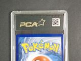 the pokemon game is in a plastic case on a table