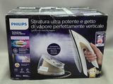 packaging of a philips steam iron sitting on top of a table