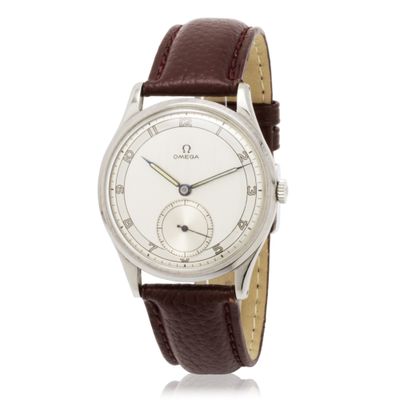 a close up of a wrist watch with a brown leather strap
